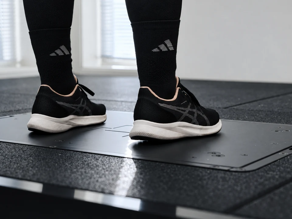 Close-up of a member's shoes on the Alphatek force plate.